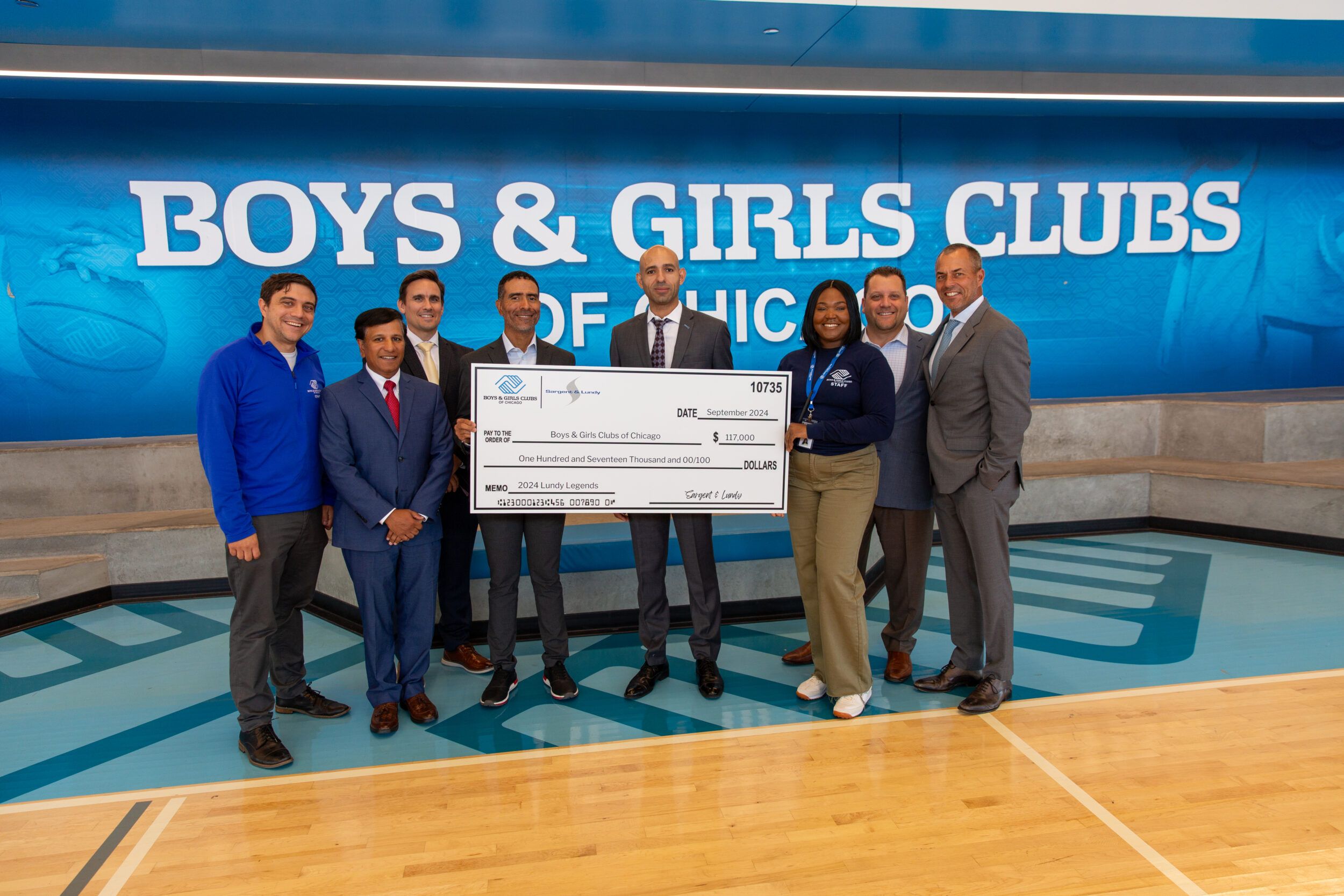 Sargent & Lundy officials present a ceremonial check to representatives of the Boys & Girls Clubs of Chicago.
