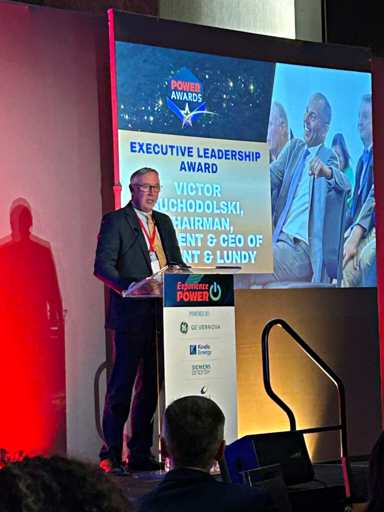 Sargent & Lundy EVP of Finance & Legal Mike Helminski accepts the Executive Leadership Award on behalf of Vic Suchodolski