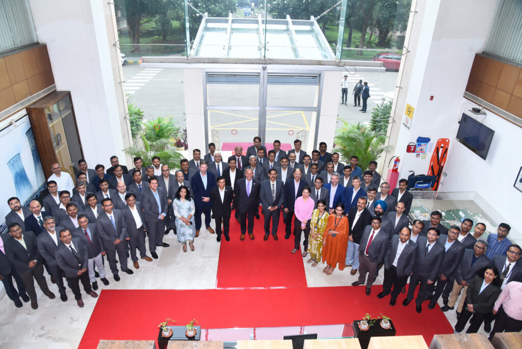 Group photo of Sargent & Lundy leaders joining with colleagues from L&T-Sargent & Lundy Limited as to mark the joint venture's 30th anniversary.