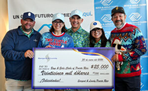 A group of people holding a check for $25,000 for the Boys & Girls Clubs of Puerto Rico.