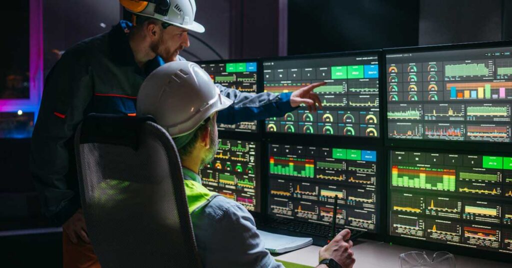 engineers at a control panel